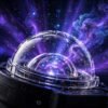 Close-up of galaxy projector device with starry projection